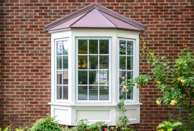 Bay window with white and brown trim showcasing a classic architectural design in Salem, NH
