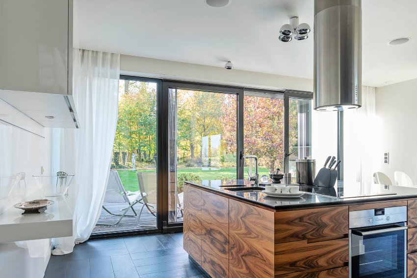 Sliding glass doors open to a modern kitchen in Salem, NH
